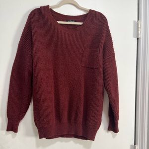 Maroon chunky knit sweater with pocket in upper left top